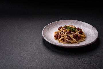 Rice noodles with beans, meat, tomato sauce, spices and herbs