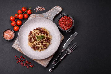 Rice noodles with beans, meat, tomato sauce, spices and herbs
