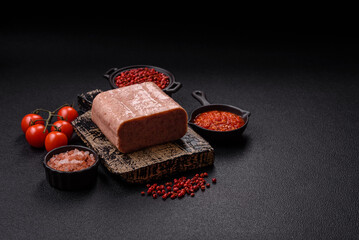Delicious canned pink spiced ham or spam with salt, spices and herbs
