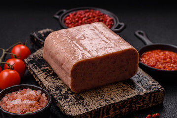 Delicious canned pink spiced ham or spam with salt, spices and herbs