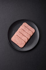 Delicious canned pink spiced ham or spam with salt, spices and herbs