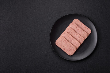 Delicious canned pink spiced ham or spam with salt, spices and herbs