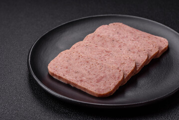 Delicious canned pink spiced ham or spam with salt, spices and herbs