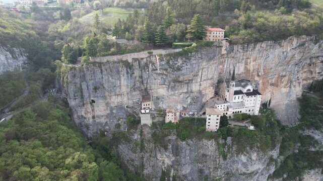 Drone flight over Santuario de la Madonna della Corona in Garda lake, Italy. Panoramic view
