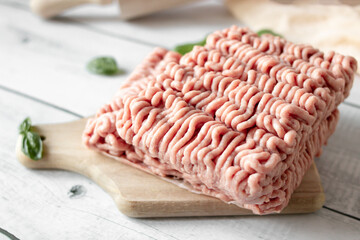 Raw minced meat , ingredients for cooking. on wooden background.
