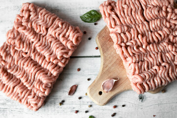 Raw minced meat , ingredients for cooking. on wooden background.