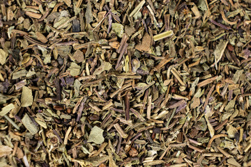 Dry basil spice seasoning macro texture top view