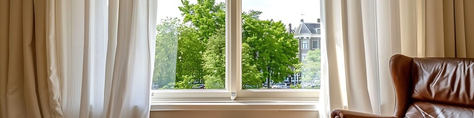 Fototapeta premium White curtains on window, brown leather chair, green trees outside, Dutch cityscape, beige walls.