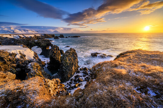 Fototapeta Gatklettur arch on Iceland during sunrise