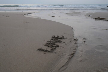 letters and writings of love in the sand on the beach. heart writings on the sand for loved ones. Happy Couples in the world. love writings in the plague of clear skies and clean air