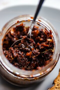 Overhead view of a jar of traditional Georgian spicy adjika