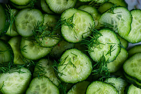 Full frame close-up of a cucumber salad with dill, olive oil and pink himalayan salt