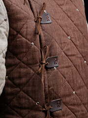 Historical fashion. Medieval knight cloth. Padded jacket gambeson.