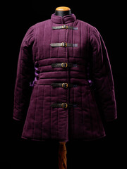 Historical fashion. Medieval knight cloth. Padded jacket gambeson.