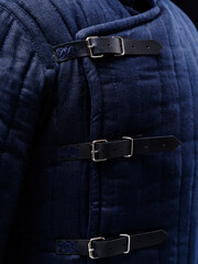 Historical fashion. Medieval knight cloth. Padded jacket gambeson.