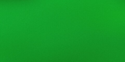 Fototapeta premium A vibrant green background, ideal for use in creative projects, presentations, or photography. The uniform color enhances visual contrast