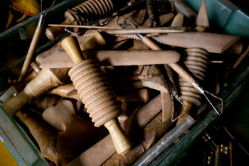 Close-up of box with set of tools for making clay pottery crafts in the aterlier