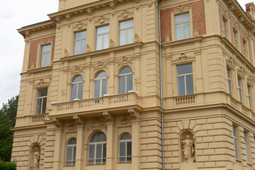 A large and towering building that features numerous windows and balconies, creating an impressive and inviting facade that enhances the skyline