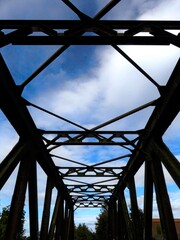 Train track, railway environment and old abandoned bridge returned to nature