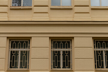 An architectural structure that features a significant number of windows, all of which are secured...