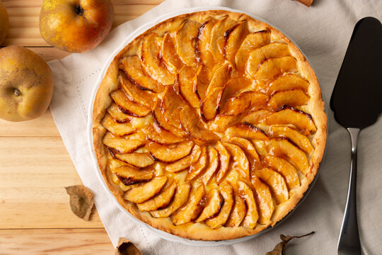 Homemade apple cake with pastry cream filling and jam cover