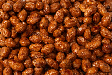 Tasty sweet roasted peanuts as a background.