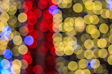 The image is a blurry, colorful, and abstract representation of a tree