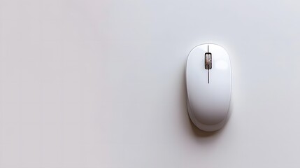 Minimalistic white wireless computer mouse on plain white background. Technology and work concept. Flat lay with copy space for banners, posters, or marketing materials.
