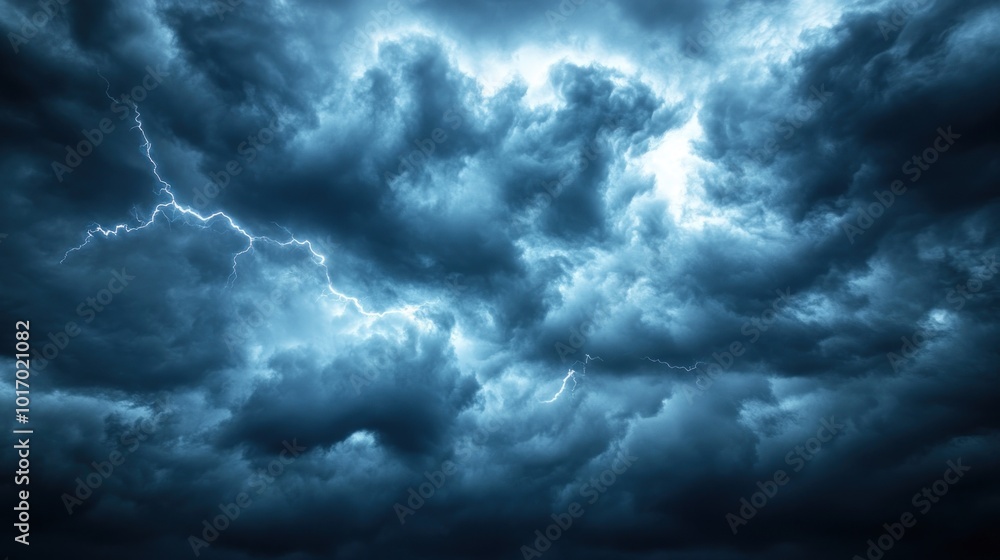 Poster dramatic storm clouds illuminated by flashes of lightning create a moody atmosphere.