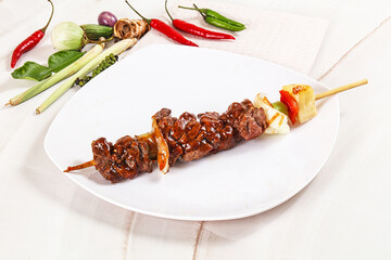 Asian grilled beef skewer with vegetables and pineapple