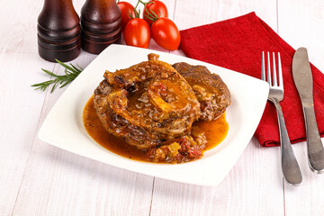Italian cuisine - ossobuco with sauce