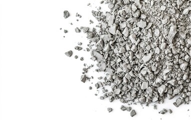 Fine gray aggregate scattered on a white surface, suitable for construction and industrial applications