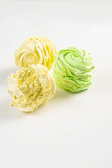 Colorful zephyrs on a white background. Perfect for food photography, dessert, and sweet treats.