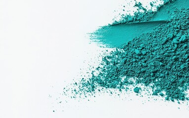 Obraz premium Fine turquoise powder spread across a white surface, highlighting texture and color in an artistic composition