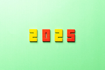 2025 numbers made from building blocks. Minimalist white background. Modern design. New Year symbol.