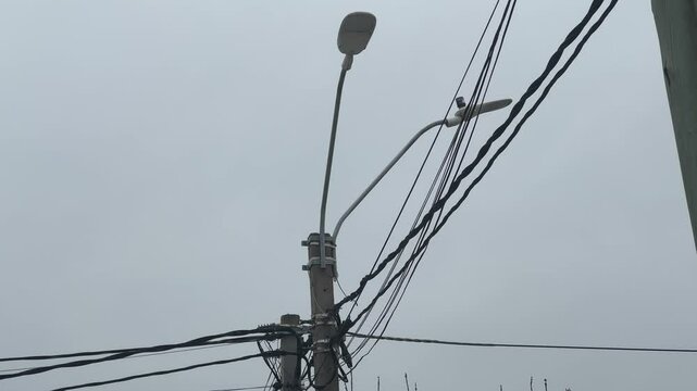 The cables hang over the poles