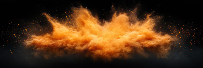 Abstract orange powder explosion on a black background.