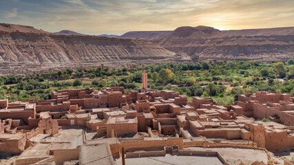 Erfoud town in the Tafilalet oasis, a tranquil desert town in Morocco surrounded by lush palm trees, blending natural beauty with traditional Moroccan architecture.
