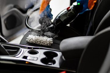 Steam cleaning process for car seats in a vehicle's interior on a sunny day