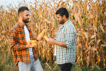 Two men working in the field together