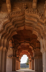 Lotus Mahal is an architectural masterpiece, a two-story structure with many open arches decorated with stucco lace. Hampi. India.