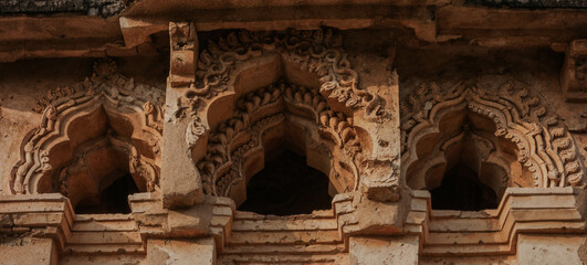 Lotus Mahal is an architectural masterpiece, a two-story structure with many open arches decorated with stucco lace. Hampi. India.