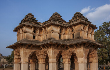 Lotus Mahal is an architectural masterpiece, a two-story structure with many open arches decorated with stucco lace. Hampi. India.