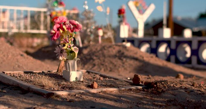 Poor man's grave with flower offerings in Cemetery  slow motion