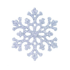 Silver glitter snowflake isolated on a transparent background. Stock photo.