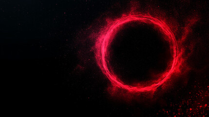 Obraz premium A glowing red circle of light, like a halo, against a dark background.