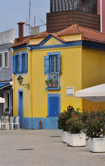 Typical yellow house in the city center, antique architecture style