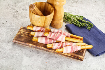 Crispy grissini italian bread with bacon