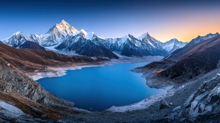 Obraz premium A Serene Glacial Lake Nestled Among Majestic Snow-Capped Mountains at Sunrise