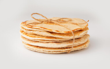 Bunch of tasty pita bread on white background
